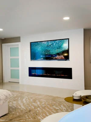 Recessed dual-screen entertainment wall with white drywall finish and integrated lighting